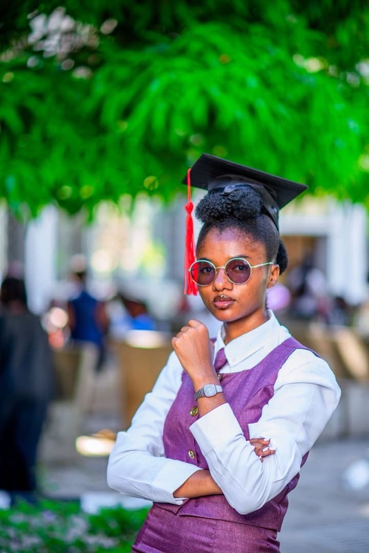 Under the tree in the mortarboard