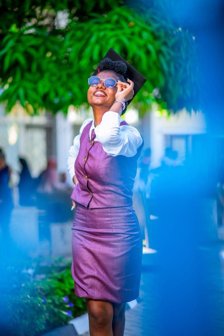 Purple suit against the blue wall