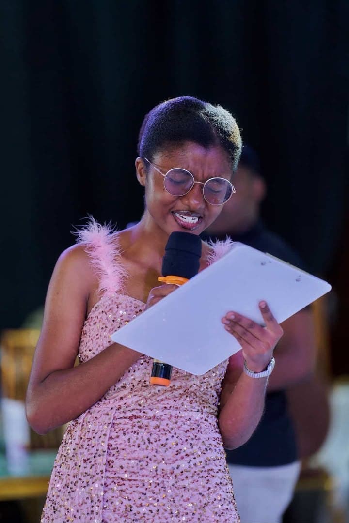 Notes in hand, microphone up