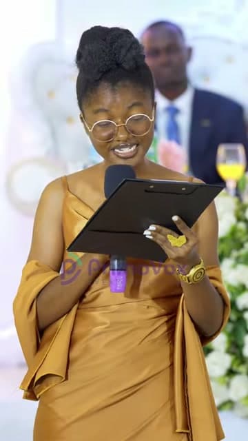 Jackline Malavanu reading a poem at a wedding